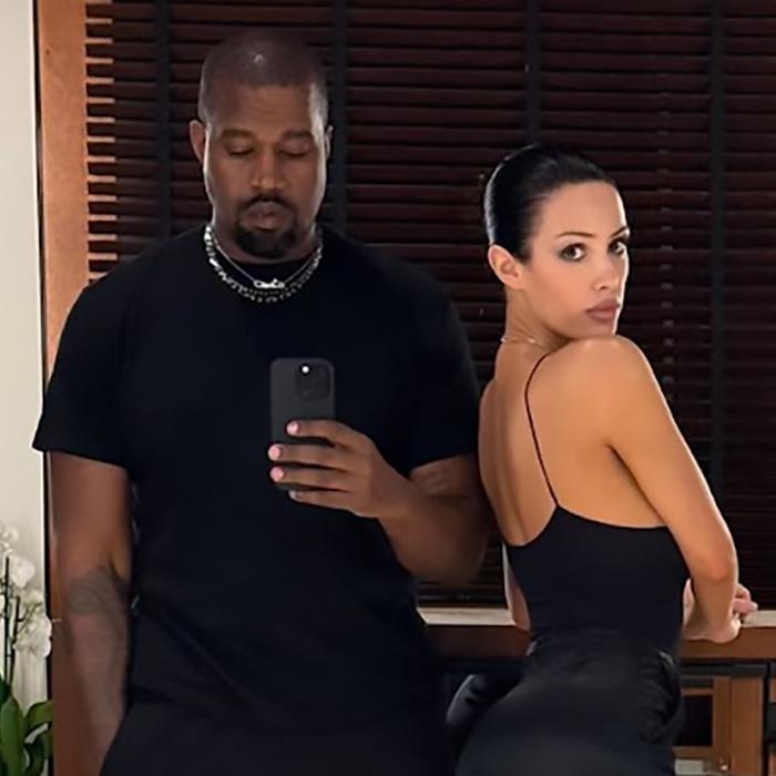 Bianca Censori and Kanye West pose indoors, with Kanye taking a mirror selfie. Bianca Censori and Kanye West pose indoors, with Kanye taking a mirror selfie.