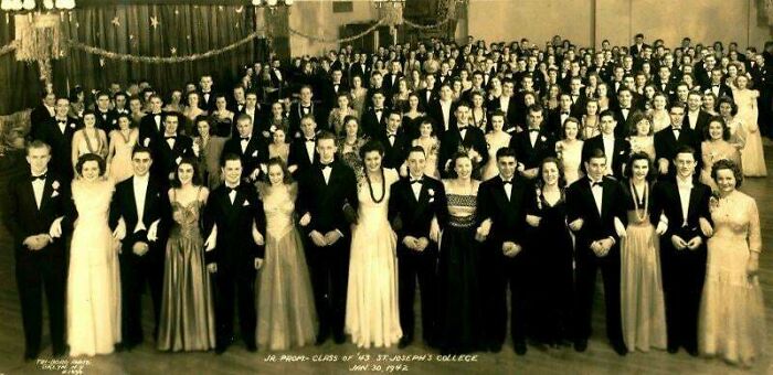 Historic group photo of St. Joseph's College class of 1944 wearing formal attire at a dance.