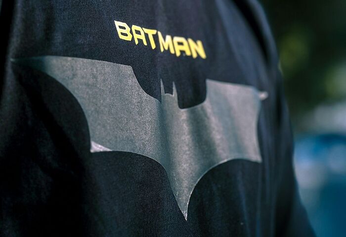 Batman logo on a black T-shirt, highlighting a lighthearted take for jokes-about-office attire.