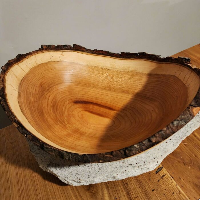 Handcrafted wooden bowl DIY project displayed on a wooden table.