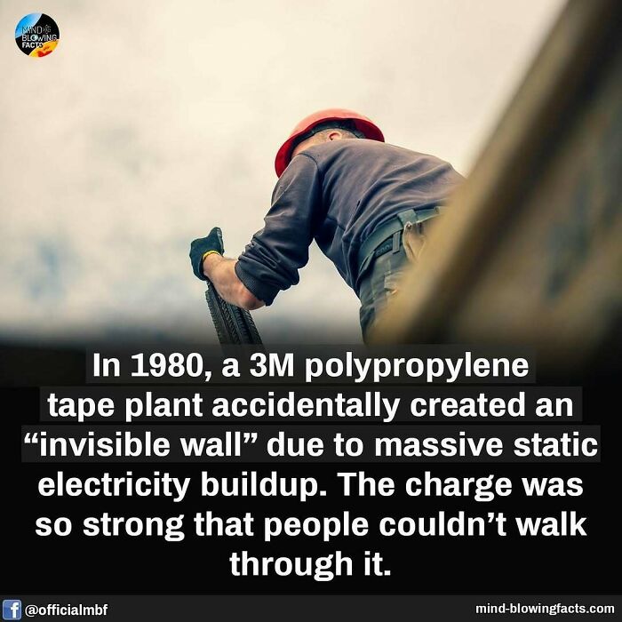 Worker in a red helmet demonstrating a static electricity phenomenon creating an invisible wall in a mind-blowing facts post.
