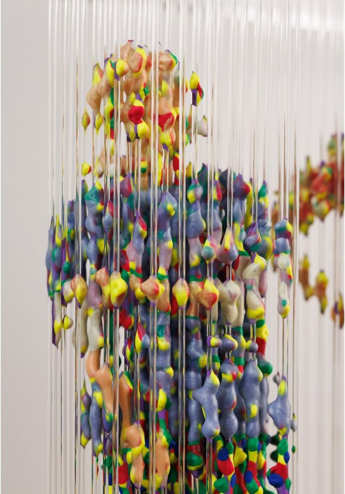 Three-dimensional painting by Chris Dorosz depicting a fragmented form made from colorful beads and rods.