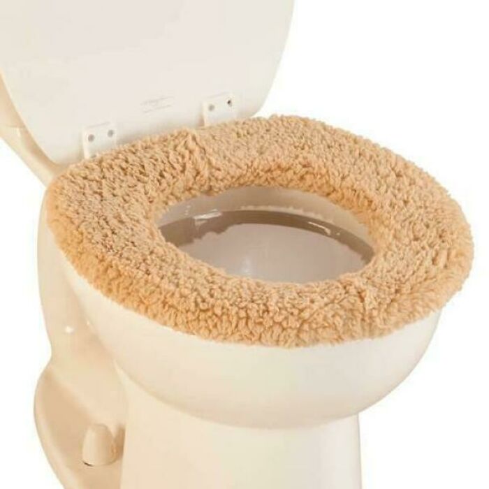 Vintage toilet with fuzzy beige seat cover, evoking nostalgic pics from people realizing they’re old now.