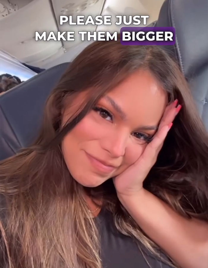 A woman on an airplane smiles, text says "Please just make them bigger," related to discrimination and airline seating. A woman on an airplane smiles, text says "Please just make them bigger," related to discrimination and airline seating.