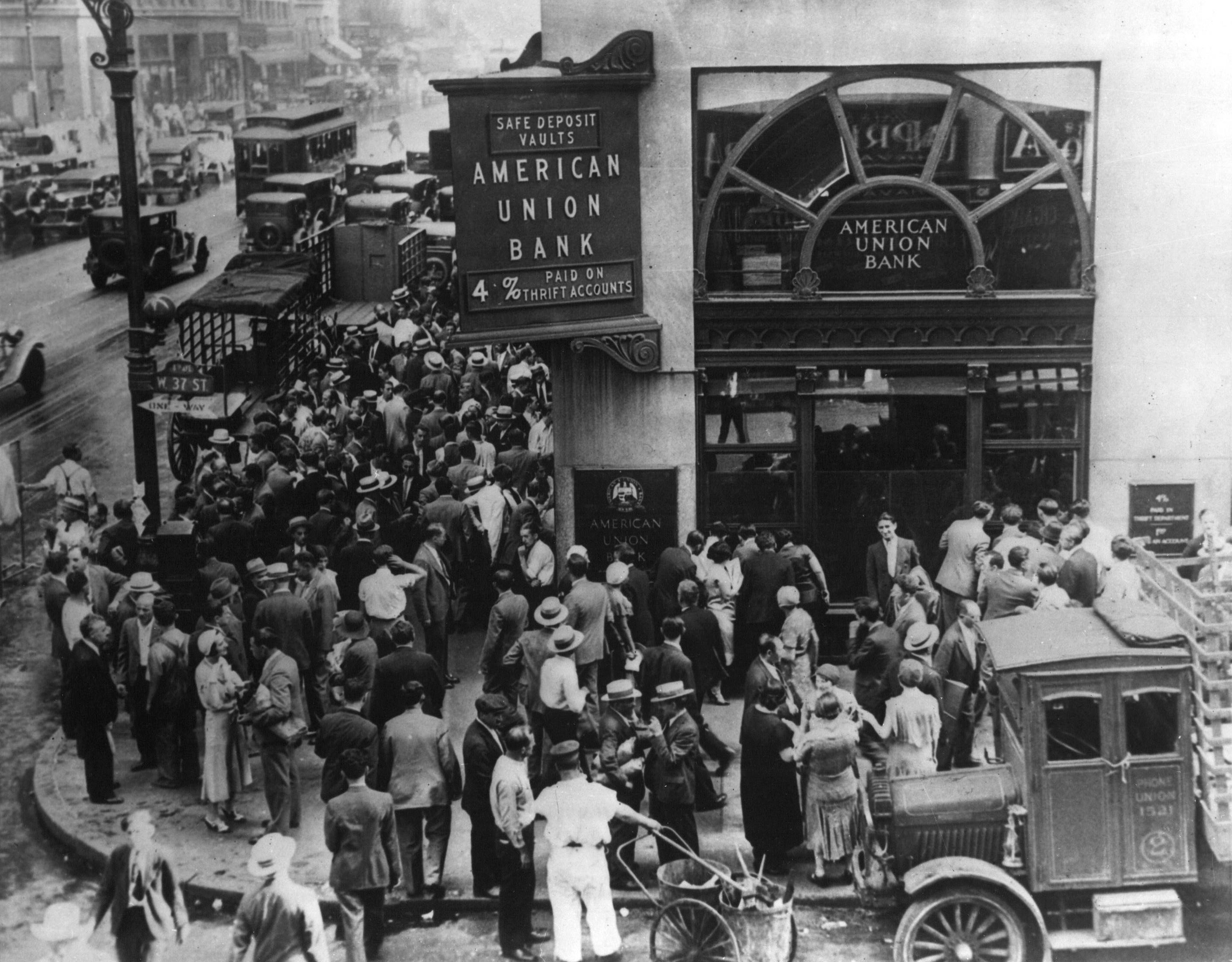 Crowd gathered outside American Union Bank during a decade-defining historical event.