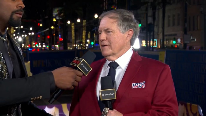 Person in a red blazer being interviewed on a lively street, holding a microphone, related to Snoop Dogg's viral age gap joke. Person in a red blazer being interviewed on a lively street, holding a microphone, related to Snoop Dogg's viral age gap joke.