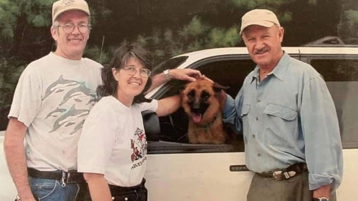 Three people and a German Shepherd by a vehicle, related to Gene Hackman investigators and surviving dogs. Three people and a German Shepherd by a vehicle, related to Gene Hackman investigators and surviving dogs.