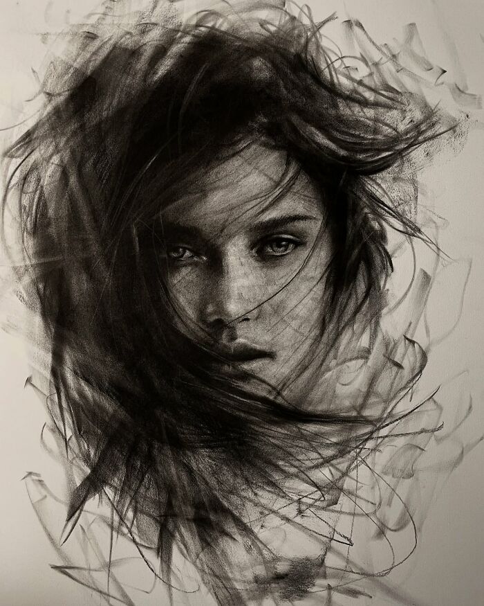 Charcoal portrait by Josh Hernandez depicting a woman's face with intricate shading and dynamic lines.