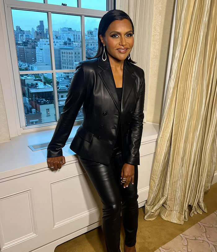 Mindy Kaling in a black leather outfit, showcasing a slim figure at a movie premiere. Mindy Kaling in a black leather outfit, showcasing a slim figure at a movie premiere.
