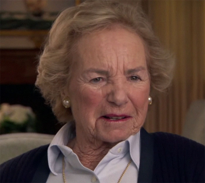 Elderly woman in a living room, wearing a pearl necklace and earrings, linked to secret Epstein documents. Elderly woman in a living room, wearing a pearl necklace and earrings, linked to secret Epstein documents.