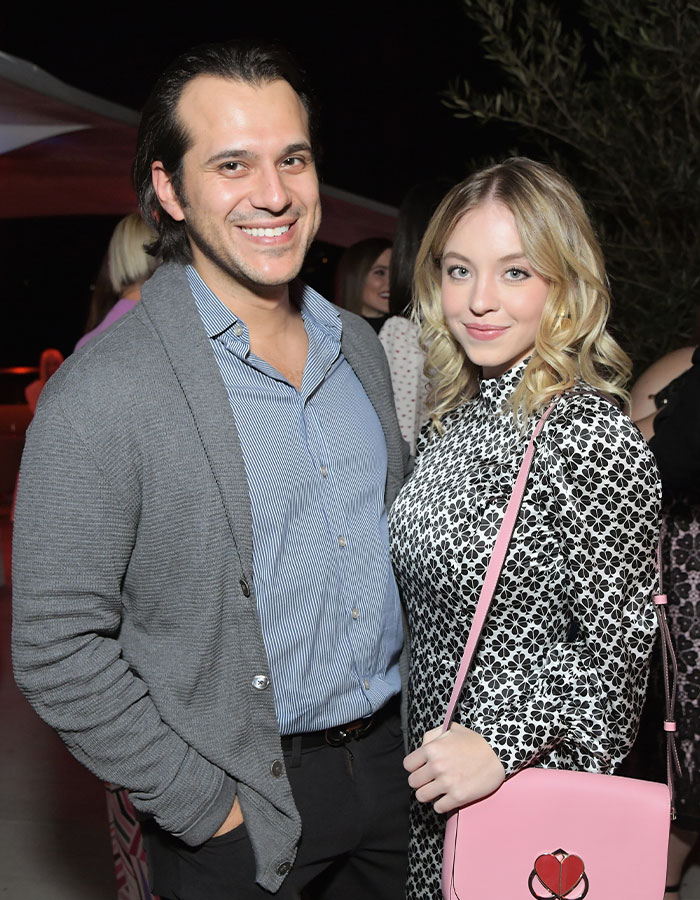 Couple smiling at an event, with keywords "Sydney Sweeney and fiancé" highlighting relationship status. Couple smiling at an event, with keywords "Sydney Sweeney and fiancé" highlighting relationship status.