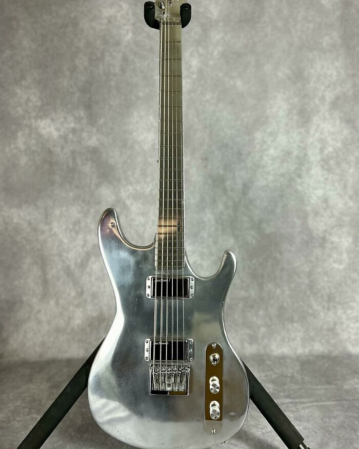 Stunning guitar made from unexpected materials, featuring a sleek metallic body and modern design.