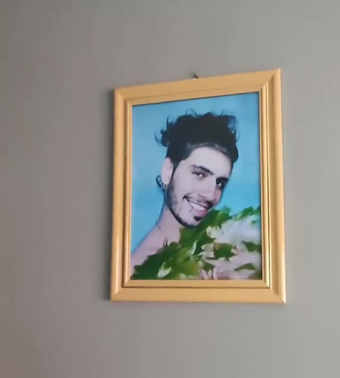 Framed photo of a man smiling, showcasing a humorous prank that amused many online. Framed photo of a man smiling, showcasing a humorous prank that amused many online.