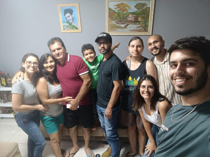 A group of family members smiling, capturing a funny prank moment that went viral on the internet. A group of family members smiling, capturing a funny prank moment that went viral on the internet.