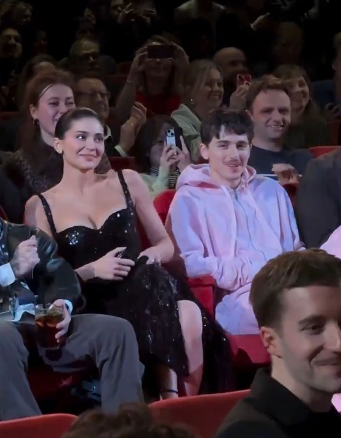 Kylie Jenner and Timothée Chalamet at a Valentine's Day red carpet event, drawing attention from the crowd. Kylie Jenner and Timothée Chalamet at a Valentine's Day red carpet event, drawing attention from the crowd.
