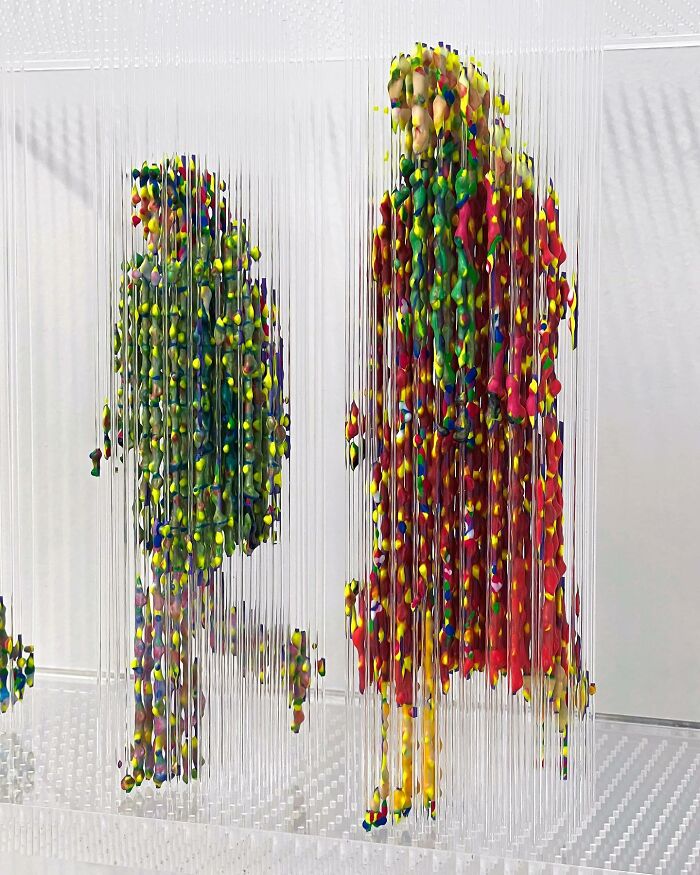 Three-dimensional, fragmented paintings of people by Chris Dorosz, featuring colorful suspended figures.