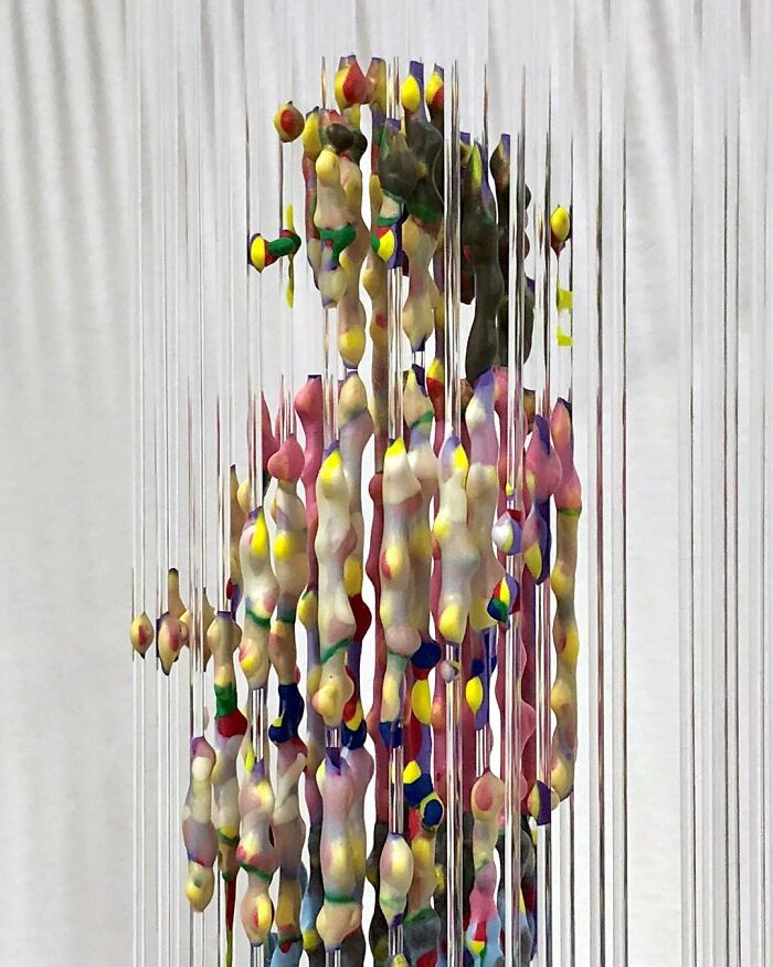 Fragmented, three-dimensional painting by Chris Dorosz, featuring colorful suspended elements forming a human figure.