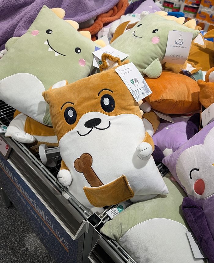 Cute kids' toy pillows displayed, including a plush animal holding a bone, sparking viral discussion. Cute kids' toy pillows displayed, including a plush animal holding a bone, sparking viral discussion.