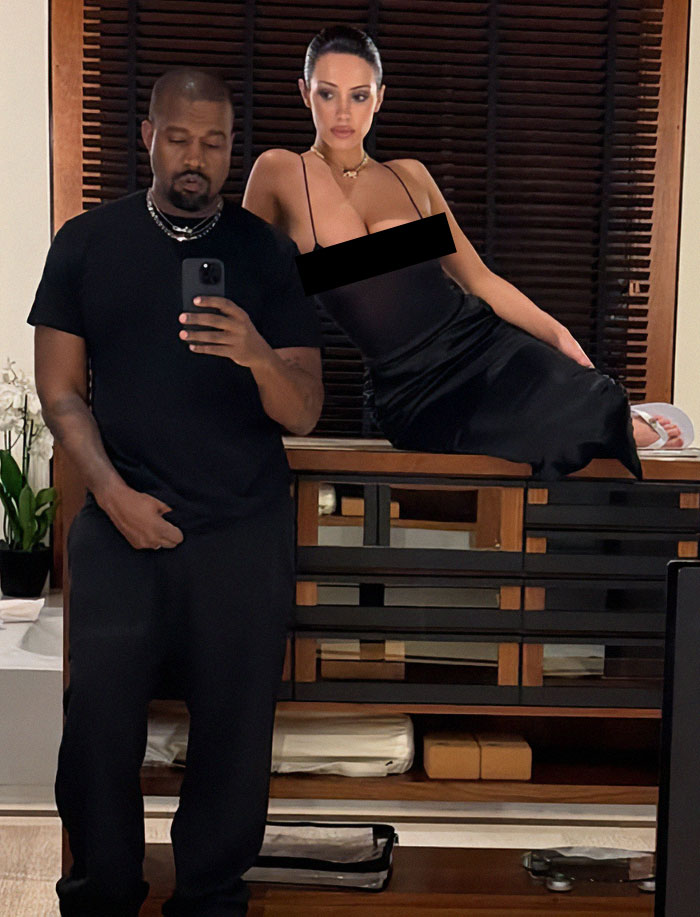 Bianca Censori in a sleek black dress, posing stylishly at a Grammys afterparty. Bianca Censori in a sleek black dress, posing stylishly at a Grammys afterparty.