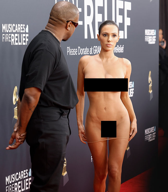 Bianca Censori on the red carpet in a controversial dress at MusiCares event, sparking celebrity criticism. Bianca Censori on the red carpet in a controversial dress at MusiCares event, sparking celebrity criticism.