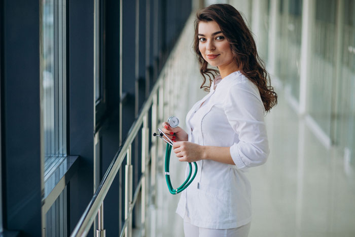 A woman in medical scrubs holding a stethoscope, representing professions with higher cheating rates. A woman in medical scrubs holding a stethoscope, representing professions with higher cheating rates.