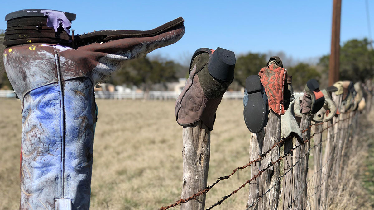 Cowboy Boots Stuck On Fences Are There For A Reason, And They’re Not For You To Touch