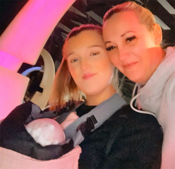 Mother and teen with baby carrier, related to 1988 pregnancy case about being pregnant without vaginal opening. Mother and teen with baby carrier, related to 1988 pregnancy case about being pregnant without vaginal opening.