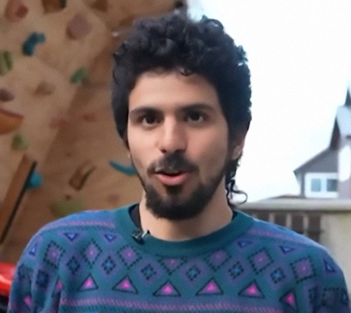 Man shares his incredible survival story, wearing a patterned sweater, standing outdoors. Man shares his incredible survival story, wearing a patterned sweater, standing outdoors.