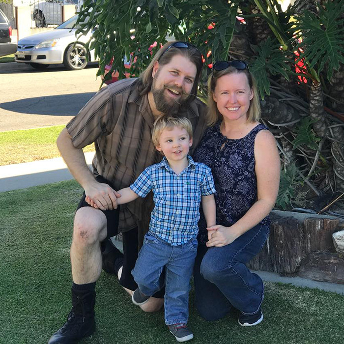 Matthew Van Andel with family smiling outdoors near a tree. Matthew Van Andel with family smiling outdoors near a tree.