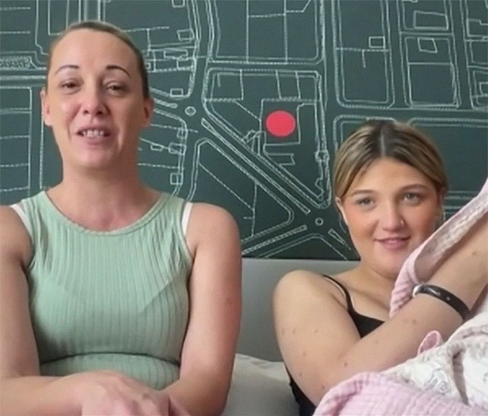 Two women smiling indoors with a map background, related to a medical case. Two women smiling indoors with a map background, related to a medical case.