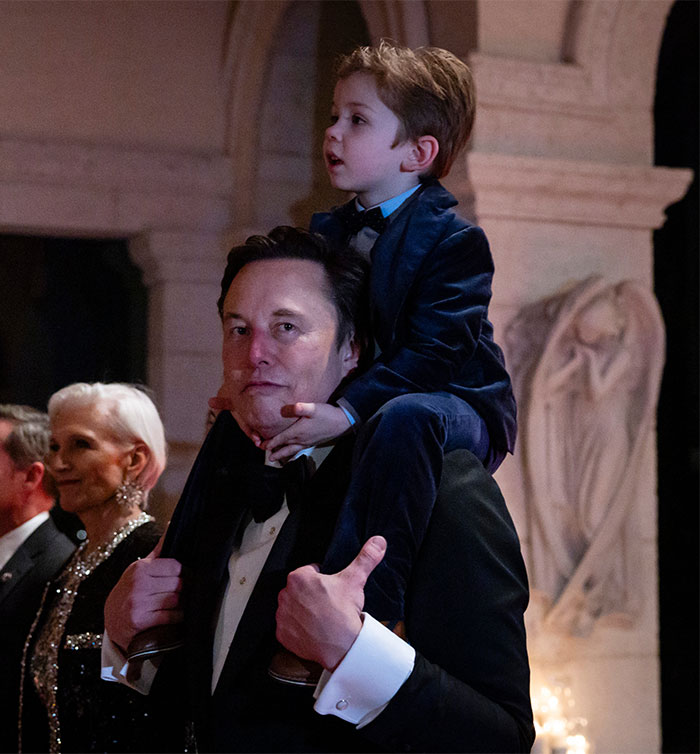 Elon Musk carrying son X Elon Musk carrying son X