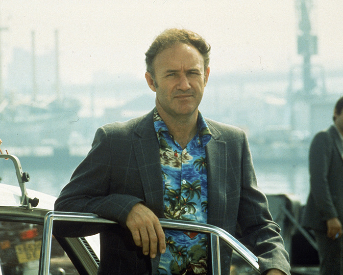A person in a tropical shirt and blazer near a marina, in relation to Gene Hackman investigators' update. A person in a tropical shirt and blazer near a marina, in relation to Gene Hackman investigators' update.