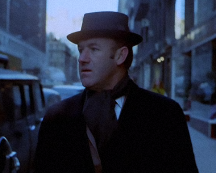Gene Hackman wearing hat outdoors in a movie scene. Gene Hackman wearing hat outdoors in a movie scene.