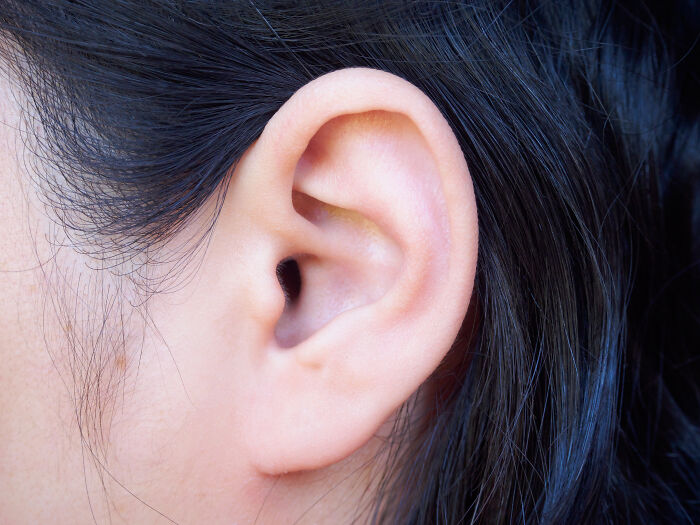 Close-up of a human ear, highlighting common hygiene habits related to stinky ears.