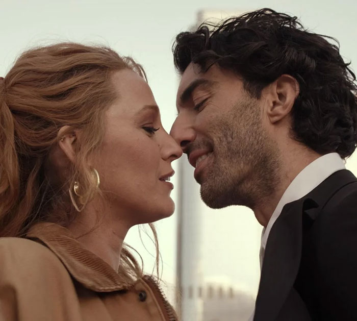 Two people facing each other closely, highlighting a tender moment related to a media headline involving Justin Baldoni's lawyer. Two people facing each other closely, highlighting a tender moment related to a media headline involving Justin Baldoni's lawyer.