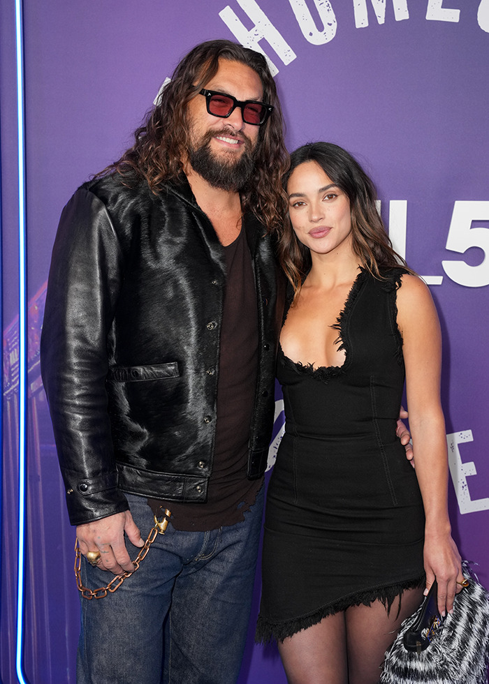Jason Momoa on the red carpet with new girlfriend, wearing stylish outfits and posing together. Jason Momoa on the red carpet with new girlfriend, wearing stylish outfits and posing together.