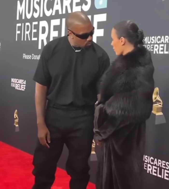 Bianca Censori and Kanye West dressed for the red carpet at a music event, engaged in conversation. Bianca Censori and Kanye West dressed for the red carpet at a music event, engaged in conversation.