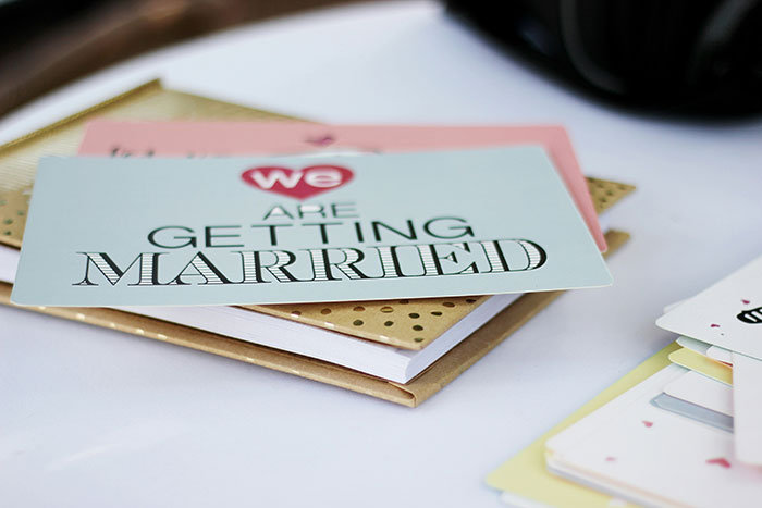 Wedding invitations on a table, with one card stating "We are getting married," emphasizing wedding planning details. Wedding invitations on a table, with one card stating "We are getting married," emphasizing wedding planning details.