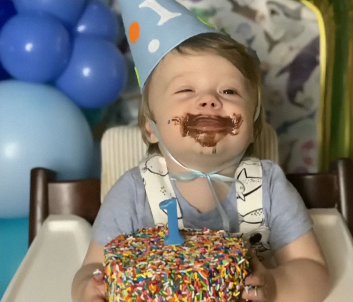 3-year-old celebrating birthday with cake, wearing a party hat, related to autism breakthrough success. 3-year-old celebrating birthday with cake, wearing a party hat, related to autism breakthrough success.