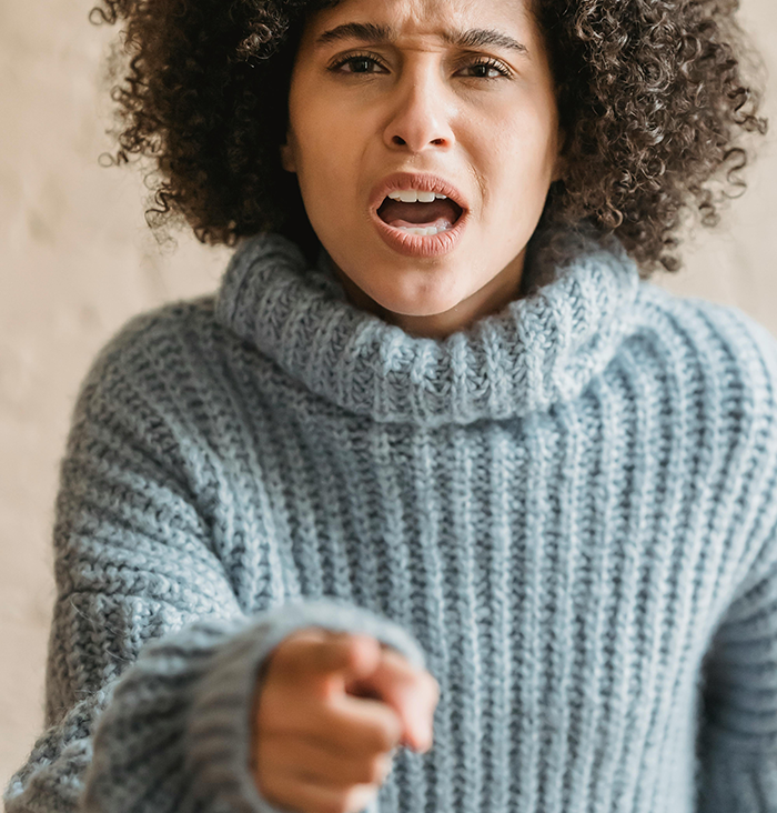 Angry woman on plane gesturing and speaking, expressing frustration. Angry woman on plane gesturing and speaking, expressing frustration.