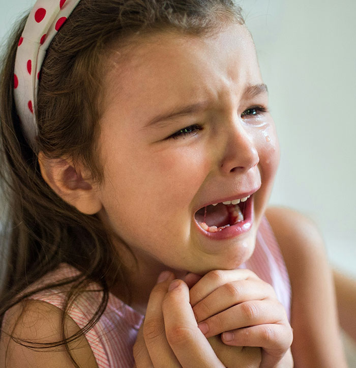 Child expressing fear, showing how negative reinforcement can help overcome fears. Child expressing fear, showing how negative reinforcement can help overcome fears.
