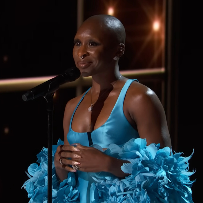 Cynthia Erivo in a blue dress at a microphone, related to musical casting. Cynthia Erivo in a blue dress at a microphone, related to musical casting.