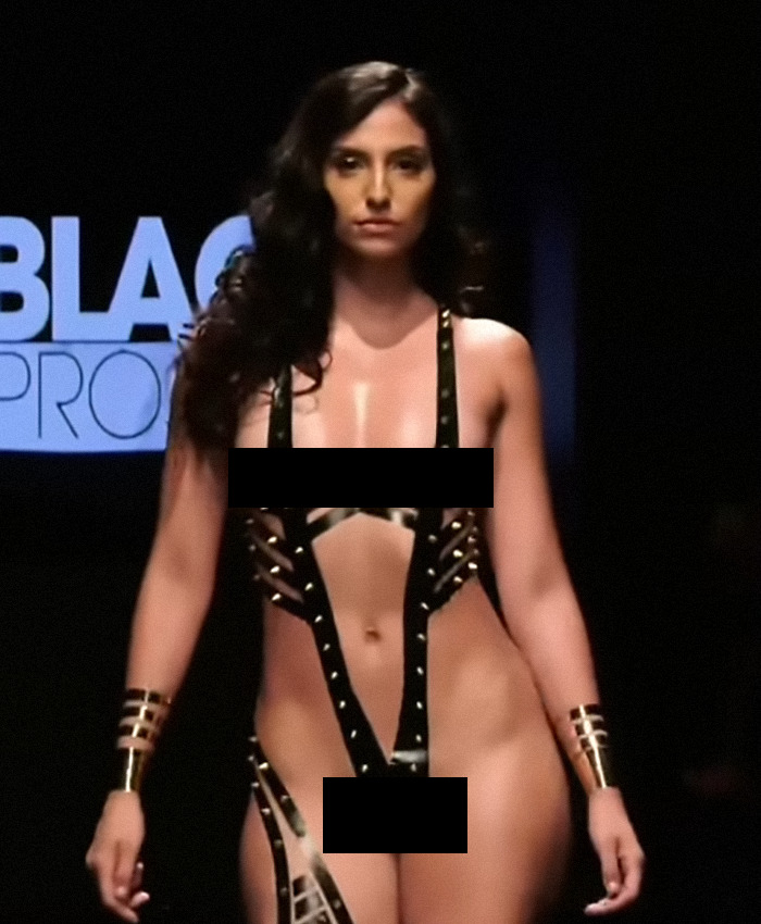Model in New York Fashion Week runway show wearing creative tape outfit. Model in New York Fashion Week runway show wearing creative tape outfit.