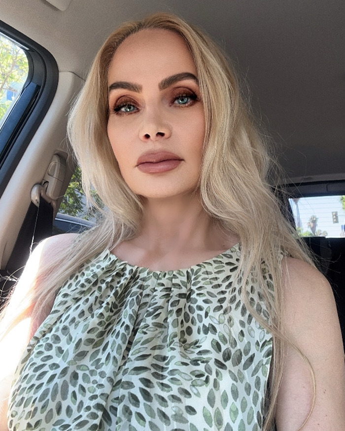 Christina Fulton in a car, wearing a patterned top. Christina Fulton in a car, wearing a patterned top.