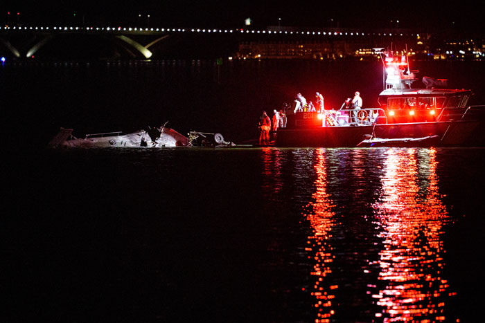 Rescue boats near crash site at night following Black Hawk drill in DC waters. Rescue boats near crash site at night following Black Hawk drill in DC waters.