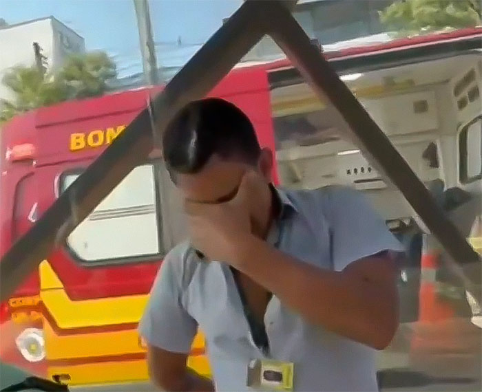 Man covering face near emergency vehicle after aviation disaster. Man covering face near emergency vehicle after aviation disaster.