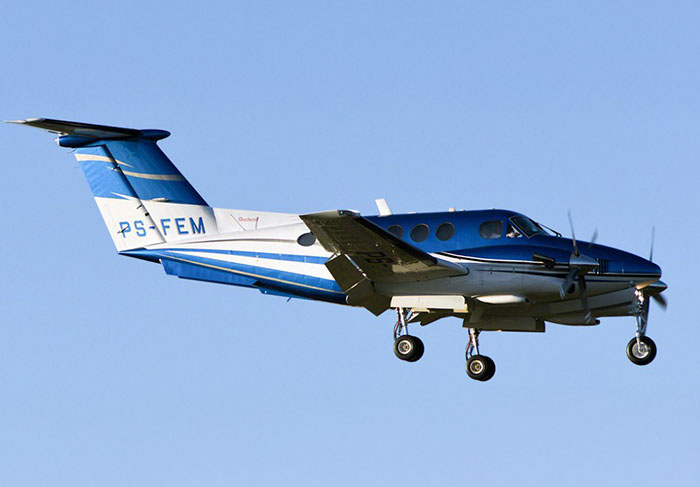 A small blue and white aircraft in flight, related to recent aviation disaster news. A small blue and white aircraft in flight, related to recent aviation disaster news.