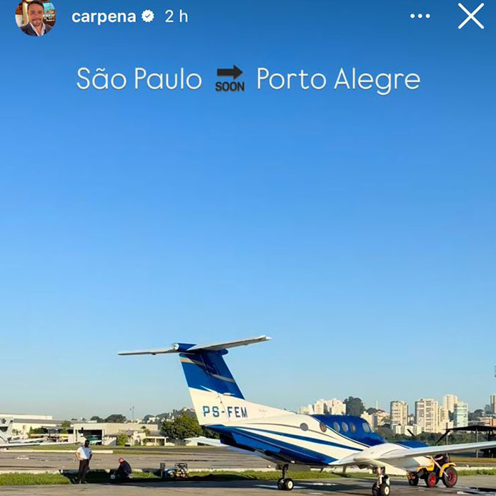 Plane waits on runway in São Paulo with city skyline, related to latest aviation disaster. Plane waits on runway in São Paulo with city skyline, related to latest aviation disaster.
