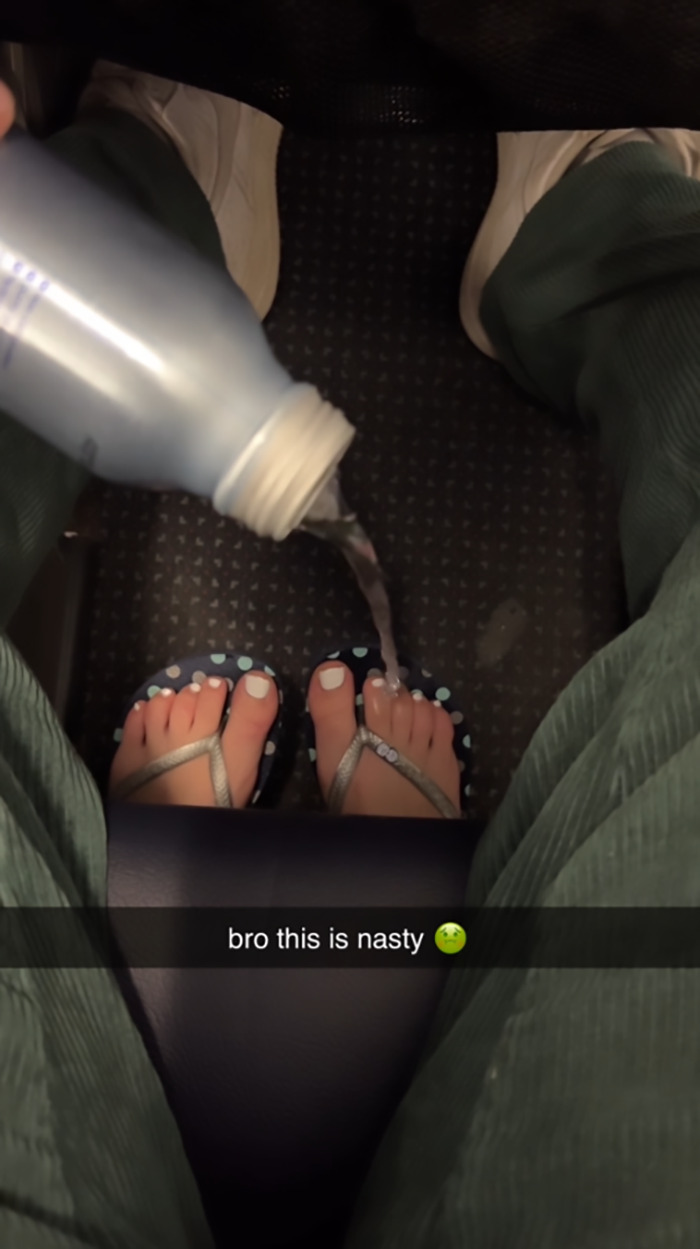 Passenger's bare feet in airplane aisle, water poured on them, video captures "instant karma" moment. Passenger's bare feet in airplane aisle, water poured on them, video captures "instant karma" moment.