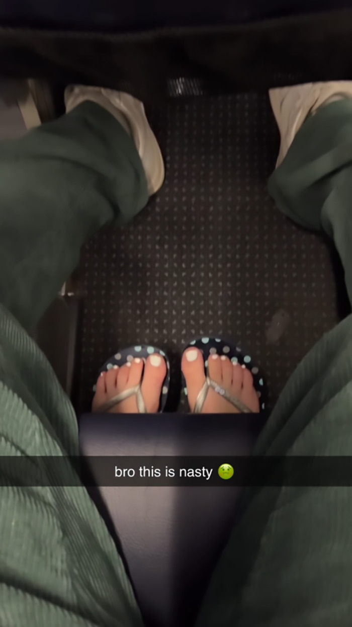 Feet in flip-flops invading personal space on flight, with caption "bro this is nasty" indicating passenger discomfort. Feet in flip-flops invading personal space on flight, with caption "bro this is nasty" indicating passenger discomfort.